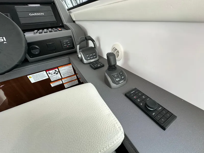 Slide: The Image of Helm controls of 2023 Cruisers Yachts 46 Cantius with Garmin navigation system. - 34