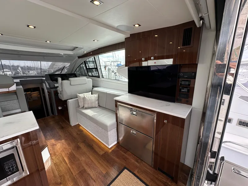 Slide: The Image of Luxurious interior of 2023 Cruisers Yachts 46 Cantius with modern amenities and elegant design. - 36