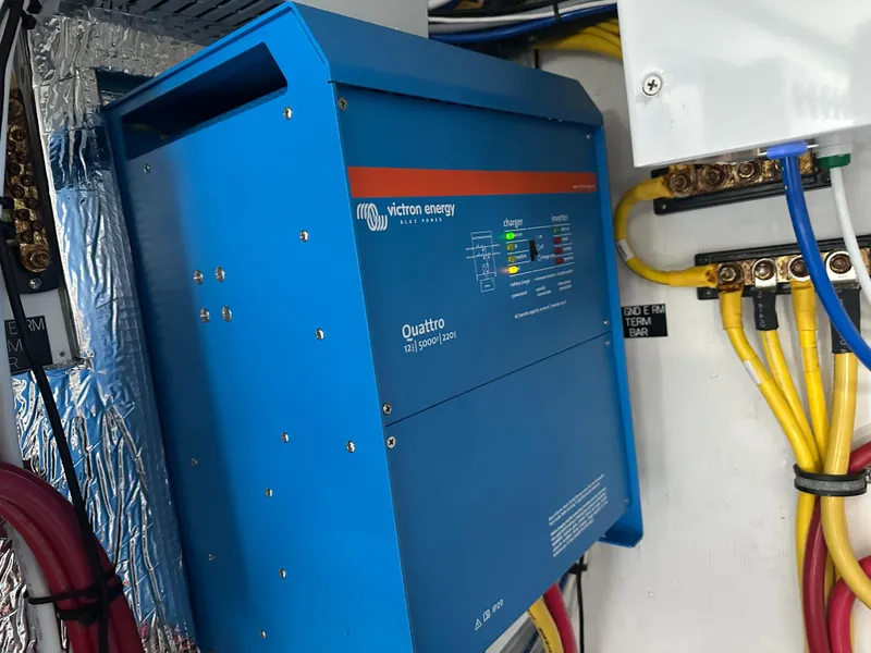 Slide: The Image of Blue Victron Energy Quattro inverter in 2023 Cruisers Yachts 46 Cantius engine room. - 42