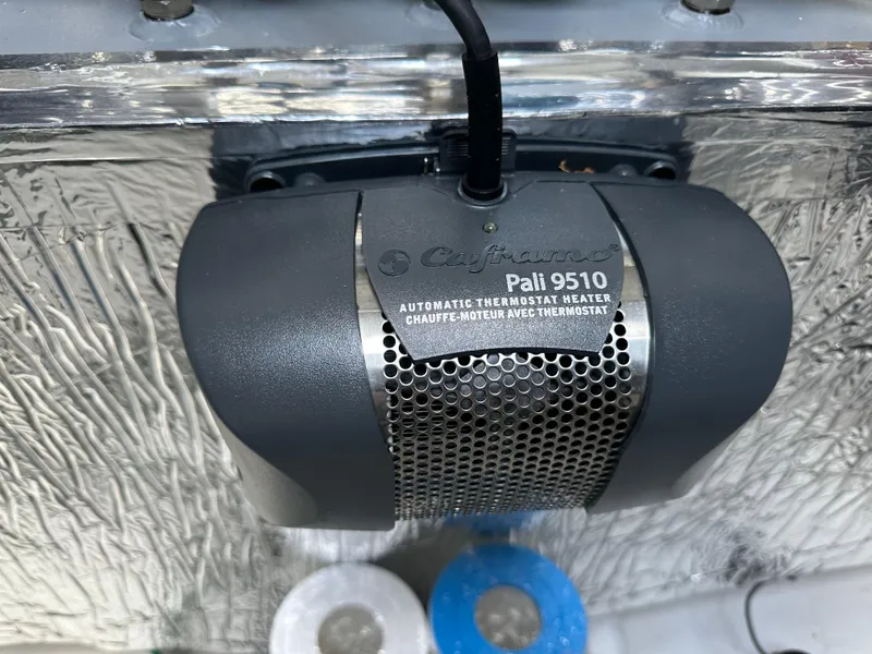 Slide: The Image of Automatic thermostat heater in 2023 Cruisers Yachts 46 Cantius engine room. - 47