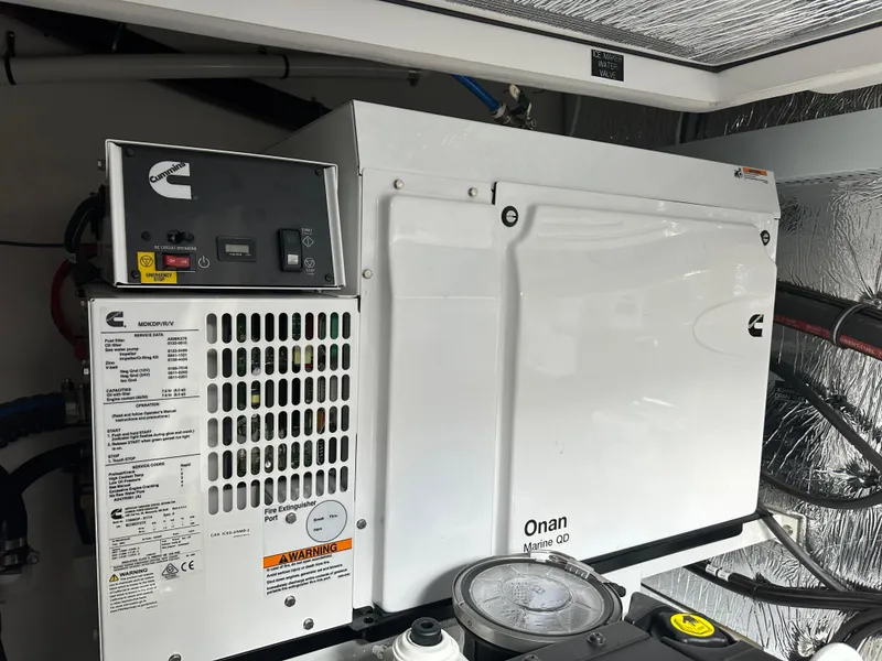 Slide: The Image of Engine room of 2023 Cruisers Yachts 46 Cantius with Onan generator. - 48
