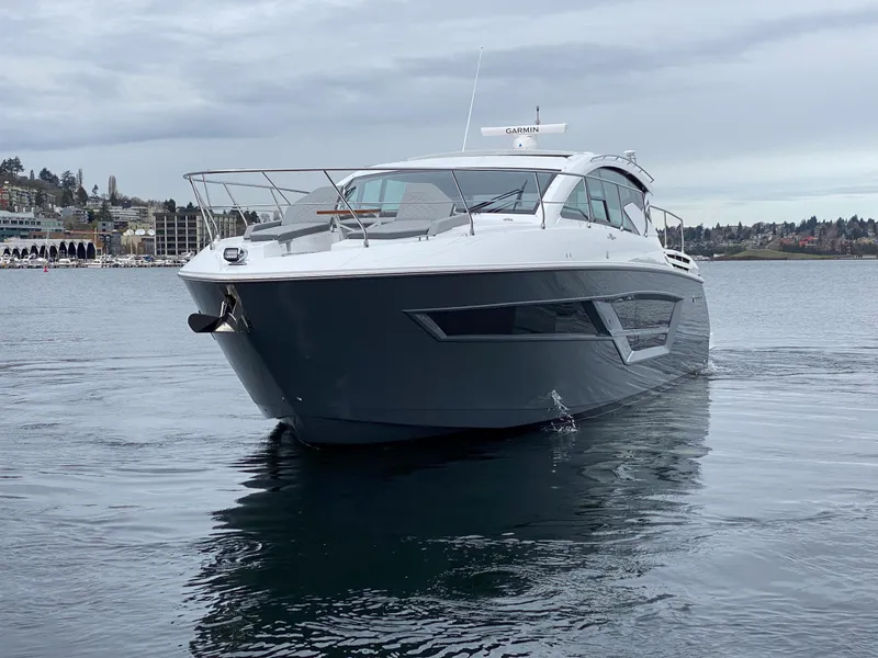 Slide: The Image of 2023 Cruisers Yachts 46 Cantius on calm water, showcasing sleek design and modern features. - 8