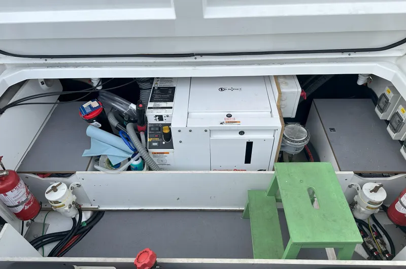 Slide: The Image of Engine compartment of 2016 Jeanneau NC 11 with equipment and fire extinguishers. - 23