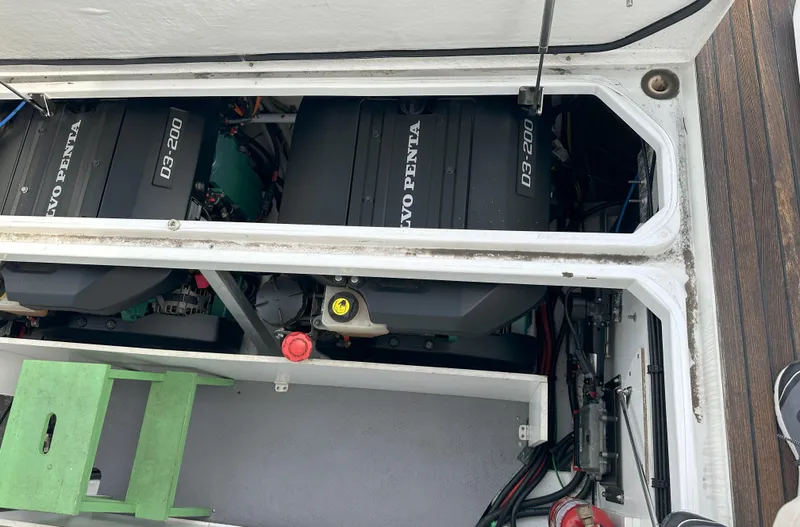Slide: The Image of Engine compartment of 2016 Jeanneau NC 11 with Volvo Penta engines visible. - 27