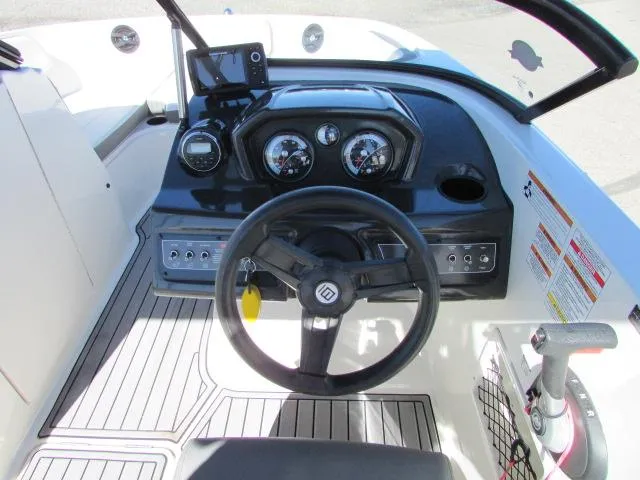 Slide: The Image of 2017 Bayliner VR6 boat dashboard with steering wheel, gauges, and control panel. - 8