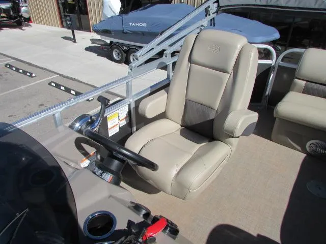 Slide: The Image of 2021 Sun Tracker Party Barge 20 DLX captain's chair and steering wheel. - 12