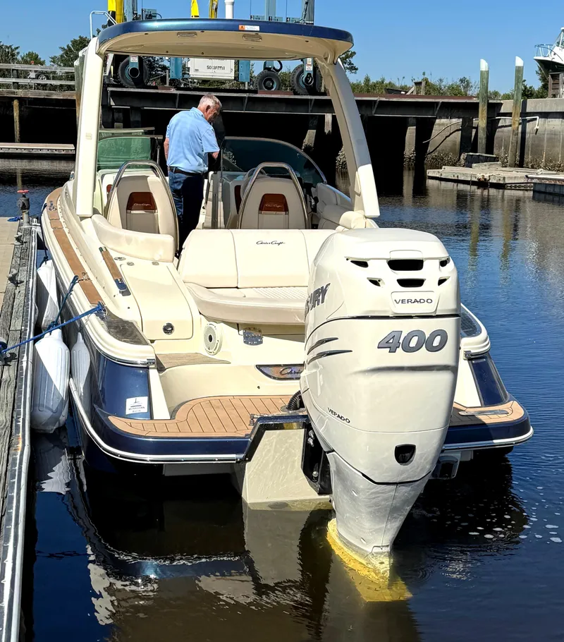 Slide: The Image of 2023 Chris-Craft Launch 28 GT boat docked with Mercury 400 engine. - 10