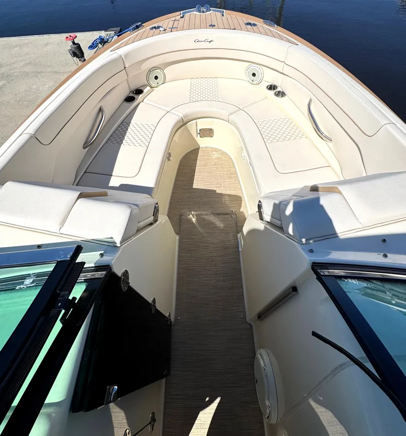 Slide: The Image of 2023 Chris-Craft Launch 28 GT boat interior with elegant seating and teak flooring. - 6