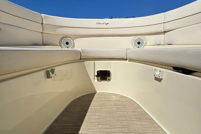 Slide: The Image of 2023 Chris-Craft Launch 28 GT boat interior with beige seating and carpet. - 7