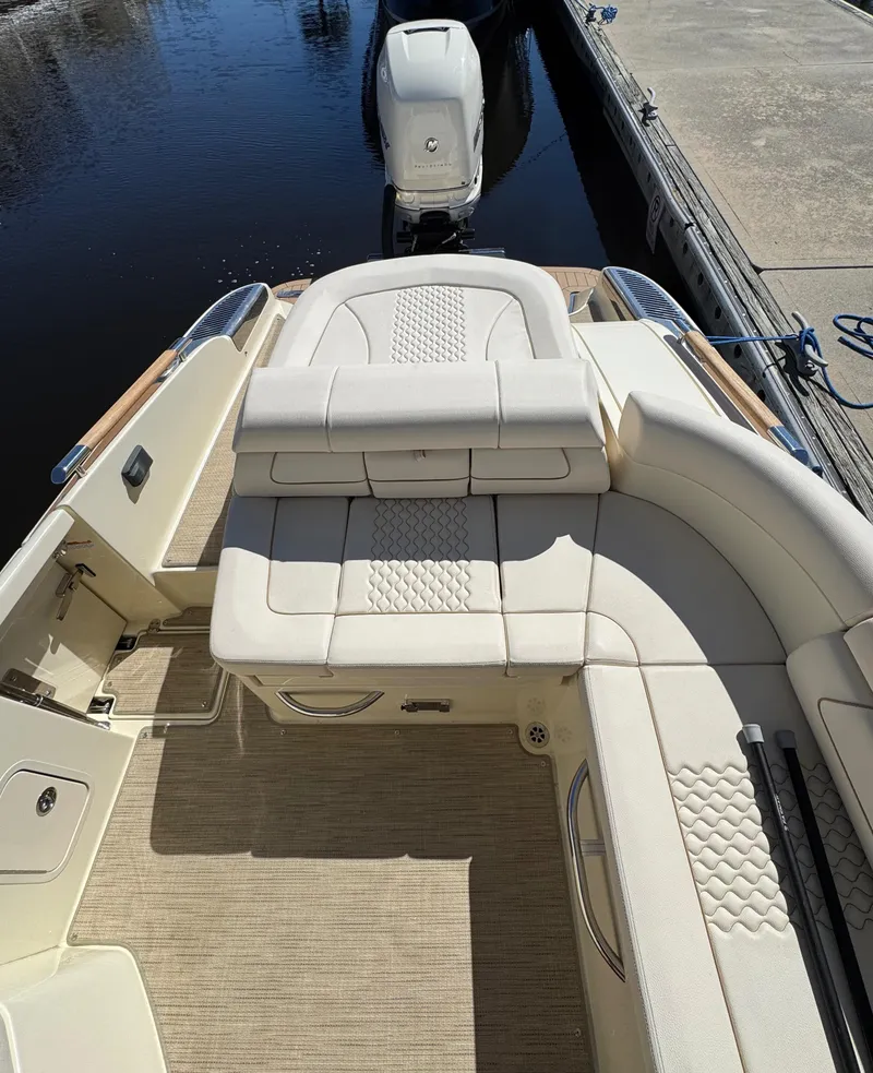 Slide: The Image of 2023 Chris-Craft Launch 28 GT boat with luxurious seating and sleek design. - 8