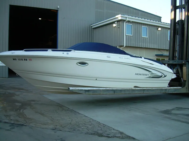 Slide: The Image of 2005 Monterey MONTURA 248 LS boat on forklift near industrial building. - 1