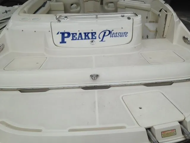 Slide: The Image of 2005 Monterey MONTURA 248 LS boat with "Peake Pleasure" text on the deck. - 12