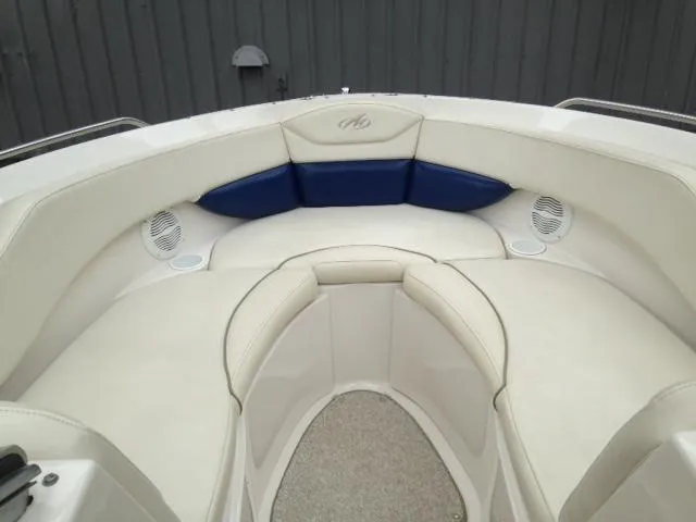 Slide: The Image of 2005 Monterey MONTURA 248 LS boat interior with white and blue seating. - 19