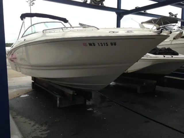 Slide: The Image of 2005 Monterey MONTURA 248 LS boat on a trailer, parked in a marina. - 25