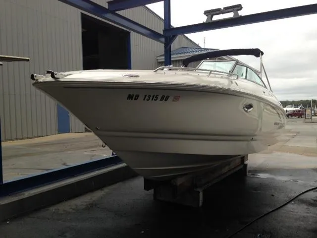 Slide: The Image of 2005 Monterey MONTURA 248 LS boat on a lift at a marina. - 26