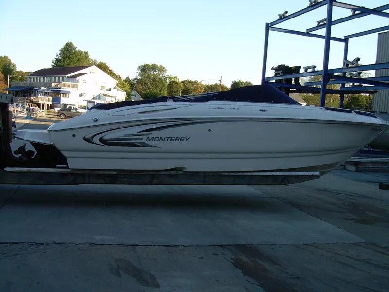 Slide: The Image of 2005 Monterey MONTURA 248 LS boat on a lift, side view. - 3