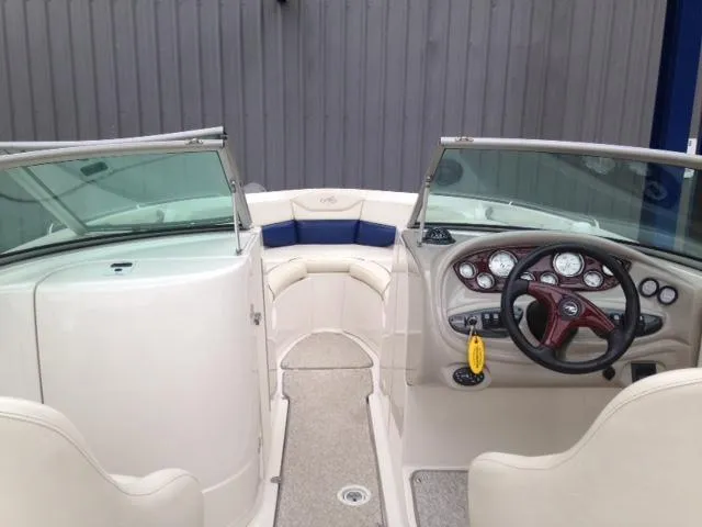 Slide: The Image of 2005 Monterey MONTURA 248 LS boat interior with steering wheel and seating area. - 6