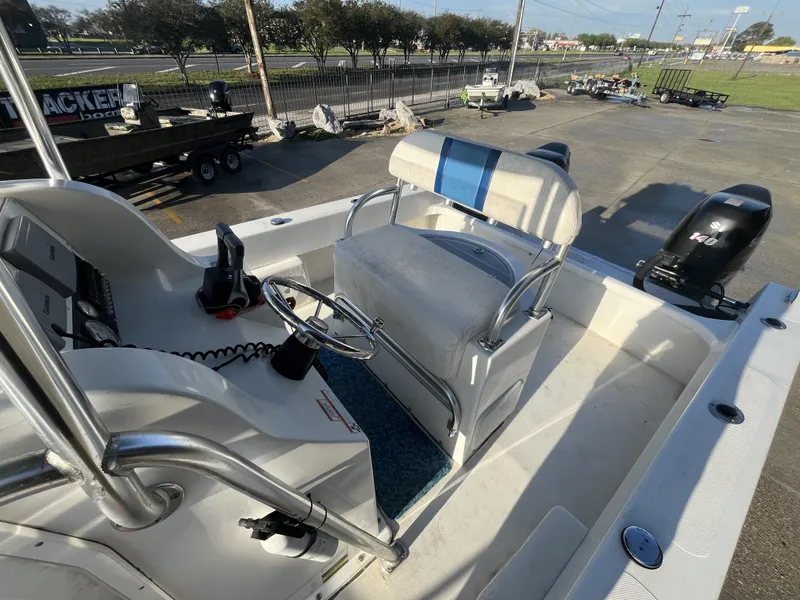 Slide: The Image of 2012 Twin Vee Ocean Cat 22 boat interior with steering console and seating. - 15