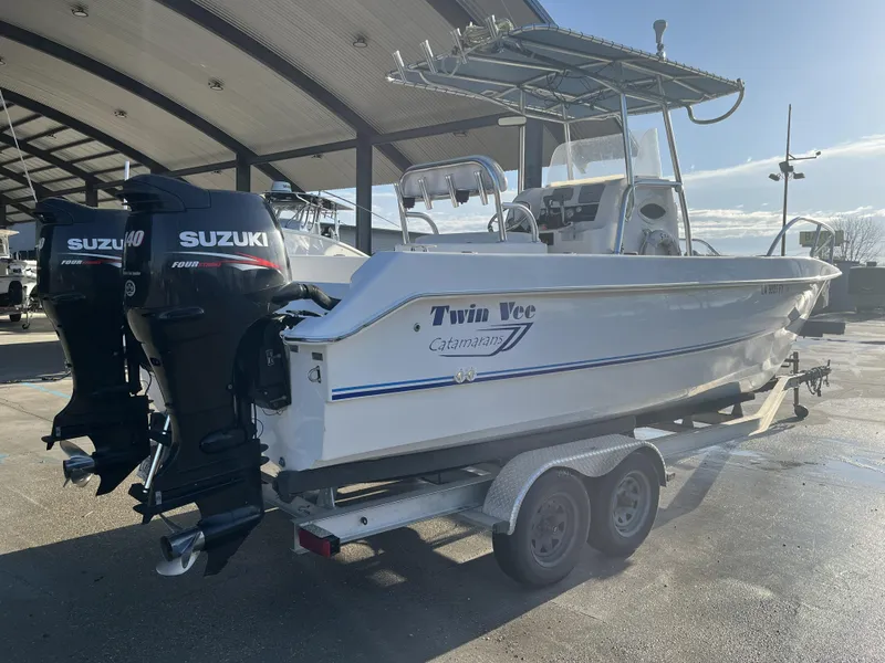 Slide: The Image of 2012 Twin Vee Ocean Cat 22 boat with Suzuki engines on a trailer. - 4