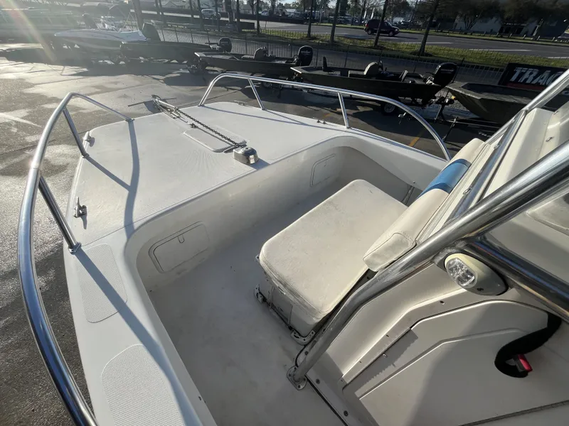 Slide: The Image of 2012 Twin Vee Ocean Cat 22 boat interior with seating and railing. - 5