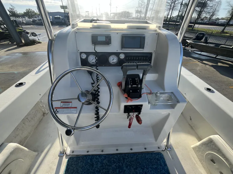 Slide: The Image of 2012 Twin Vee Ocean Cat 22 boat console with steering wheel and controls. - 7