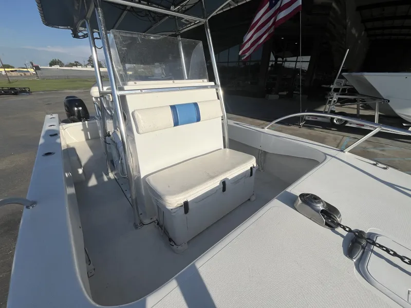 Slide: The Image of 2012 Twin Vee Ocean Cat 22 boat interior with seating and American flag. - 9