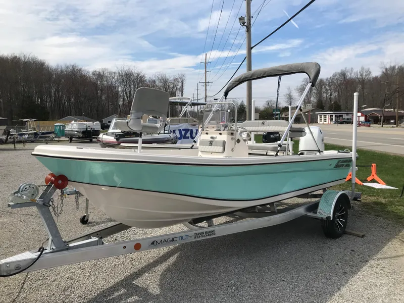 Slide: The Image of 2025 Carolina Skiff 178 JLS boat on trailer, parked outdoors. - 1