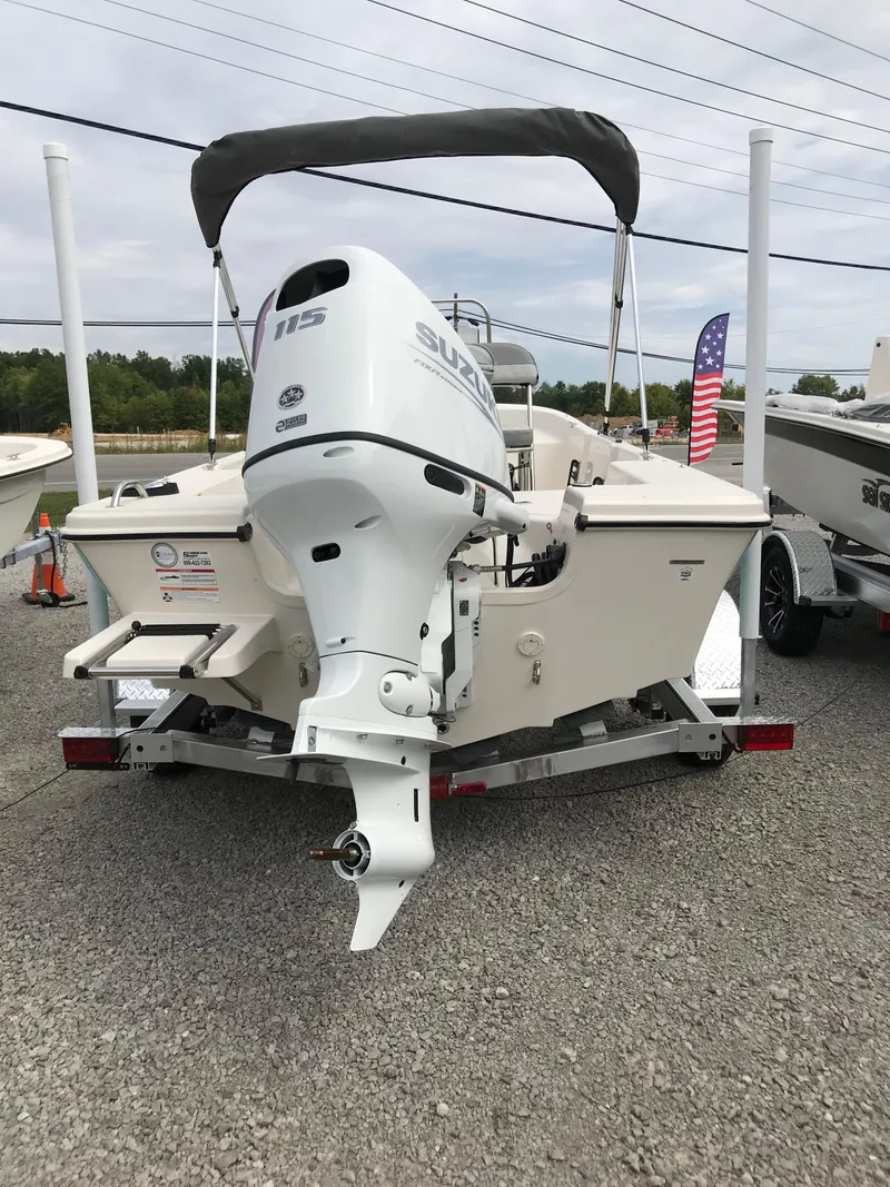 Slide: The Image of 2025 Carolina Skiff 178 JLS boat with Suzuki outboard motor on trailer. - 14