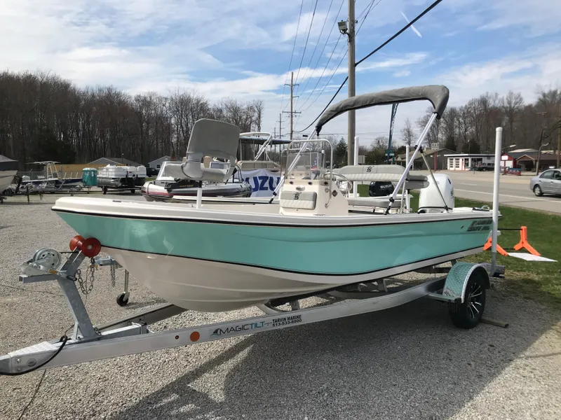 Slide: The Image of 2025 Carolina Skiff 178 JLS boat on trailer, parked outdoors, with bimini top. - 3