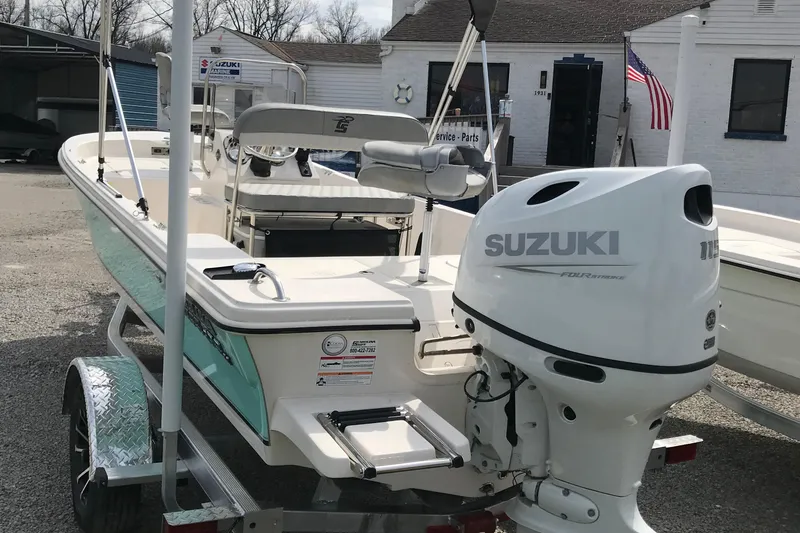 Slide: The Image of 2025 Carolina Skiff 178 JLS boat with Suzuki outboard motor on trailer. - 4