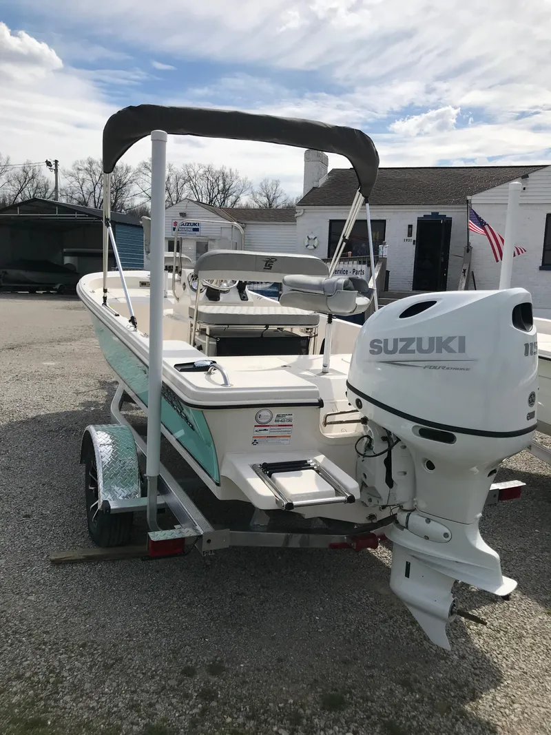 Slide: The Image of 2025 Carolina Skiff 178 JLS boat with Suzuki outboard motor on a trailer. - 9