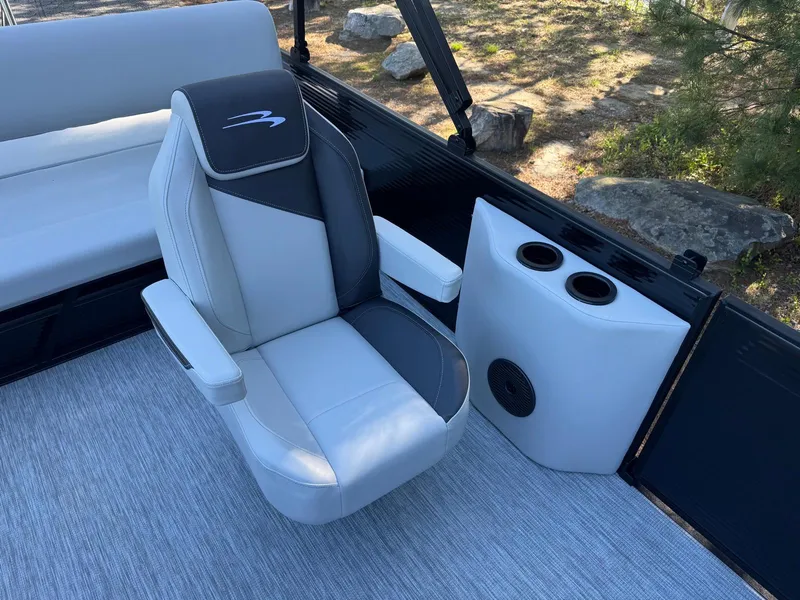 Slide: The Image of 2025 Bennington 22SSB boat interior with luxury seating and cup holders. - 11
