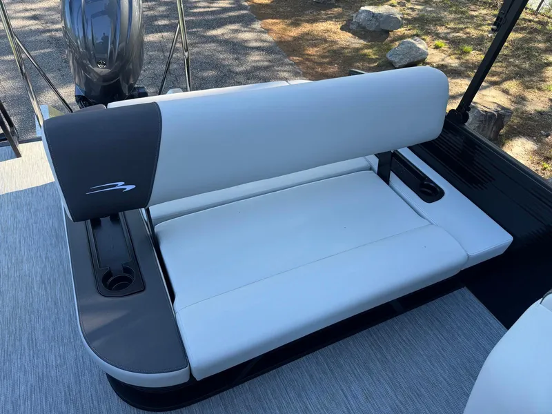 Slide: The Image of 2025 Bennington 22SSB boat seat with sleek white and gray upholstery. - 12