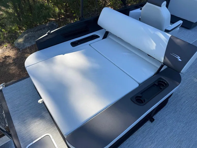 Slide: The Image of 2025 Bennington 22SSB boat interior with cushioned seating and cup holders. - 13