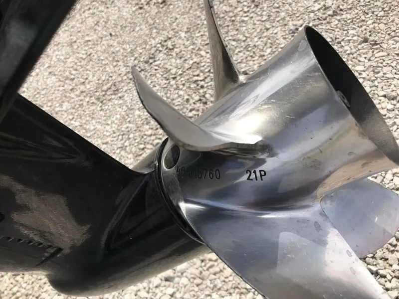 Slide: The Image of Propeller of 2013 Ranger 186 Reata boat on gravel surface. - 8