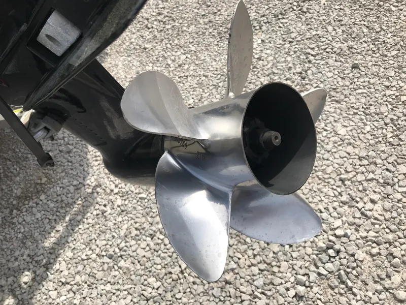 Slide: The Image of Propeller of 2013 Ranger 186 Reata boat on gravel surface. - 9