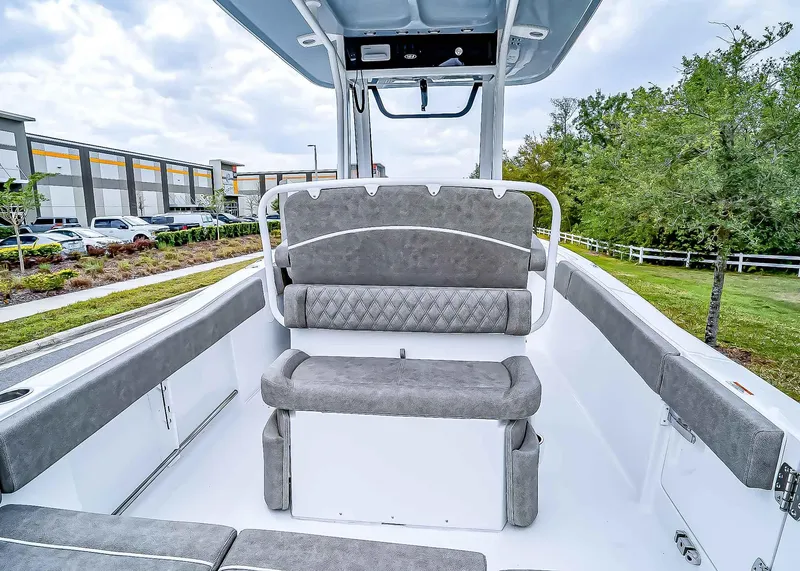 Slide: The Image of 2025 Sea Hunt Ultra 235 SE boat interior with gray seating and modern design. - 11