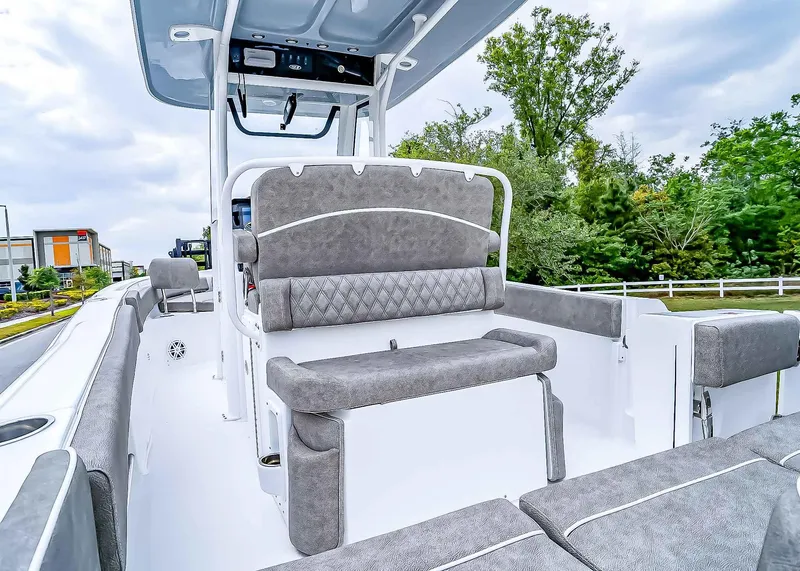 Slide: The Image of 2025 Sea Hunt Ultra 235 SE boat interior with gray seating and modern design. - 12