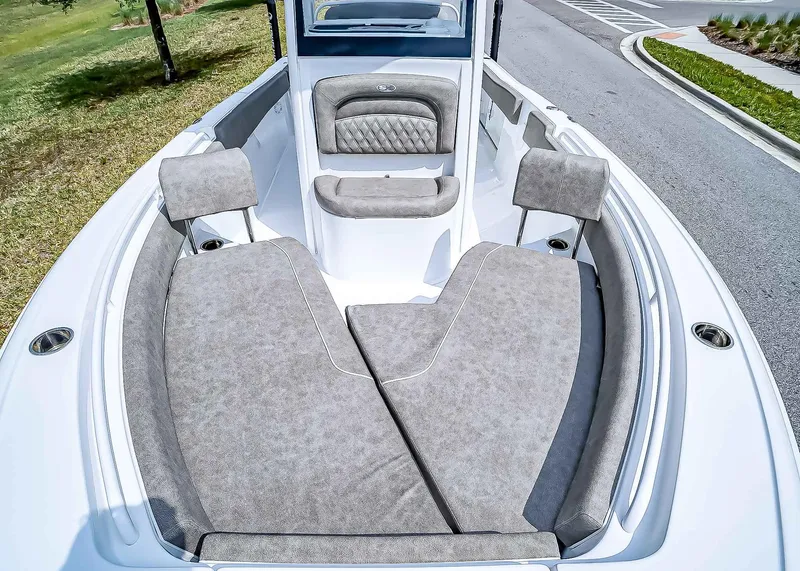 Slide: The Image of 2025 Sea Hunt Ultra 235 SE boat interior with cushioned seating and sleek design. - 23