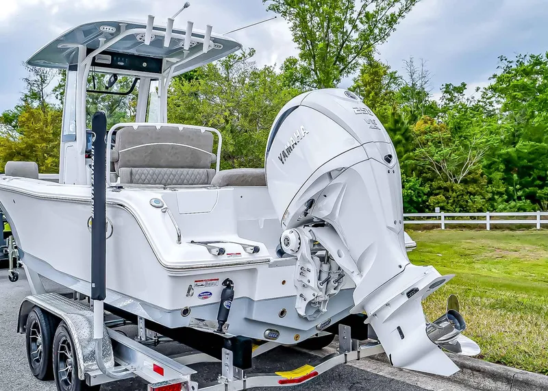 Slide: The Image of 2025 Sea Hunt Ultra 235 SE boat on trailer with Yamaha outboard motor. - 5