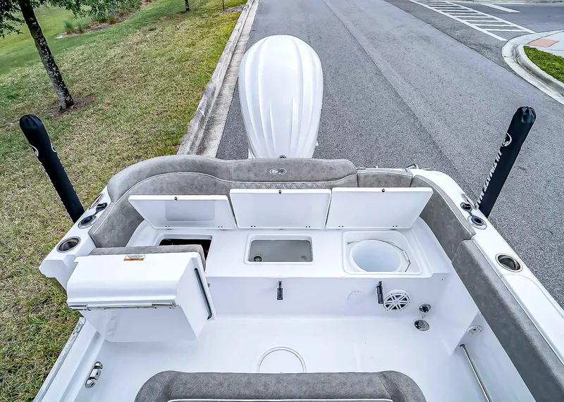 Slide: The Image of 2025 Sea Hunt Ultra 235 SE boat interior with storage compartments and seating. - 8