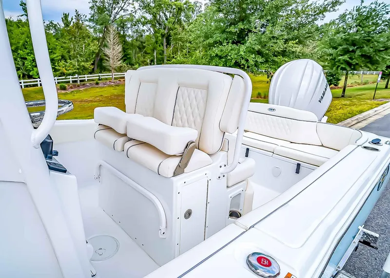 Slide: The Image of 2025 Sea Hunt Ultra 245 SE boat interior with plush seating and modern design. - 13