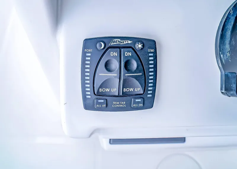 Slide: The Image of Trim tab control panel on 2025 Sea Hunt Ultra 245 SE boat. - 18