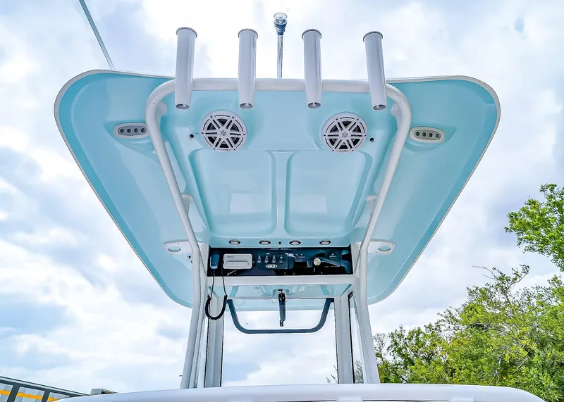 Slide: The Image of T-top of 2025 Sea Hunt Ultra 245 SE boat with rod holders and speakers. - 19