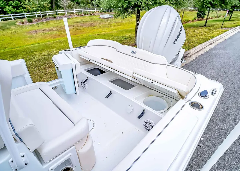 Slide: The Image of 2025 Sea Hunt Ultra 245 SE boat interior with seating and storage compartments. - 9