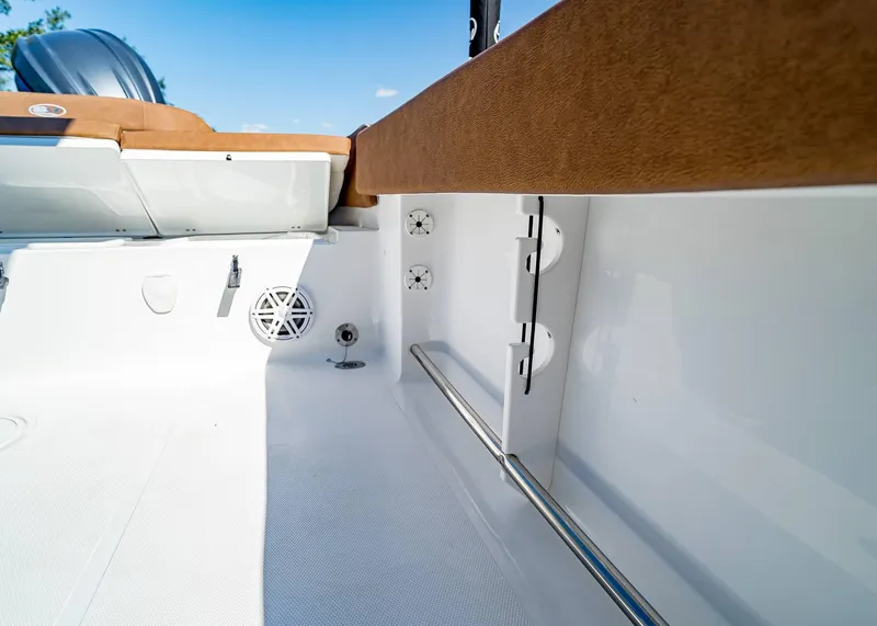 Slide: The Image of 2025 Sea Hunt Ultra 235 SE boat interior, featuring seating and speaker details. - 17