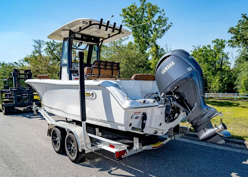 Slide: The Image of 2025 Sea Hunt Ultra 235 SE boat on trailer with Yamaha outboard motor. - 4