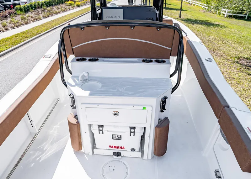 Slide: The Image of 2025 Sea Hunt Ultra 245 SE boat interior with seating and storage features. - 15