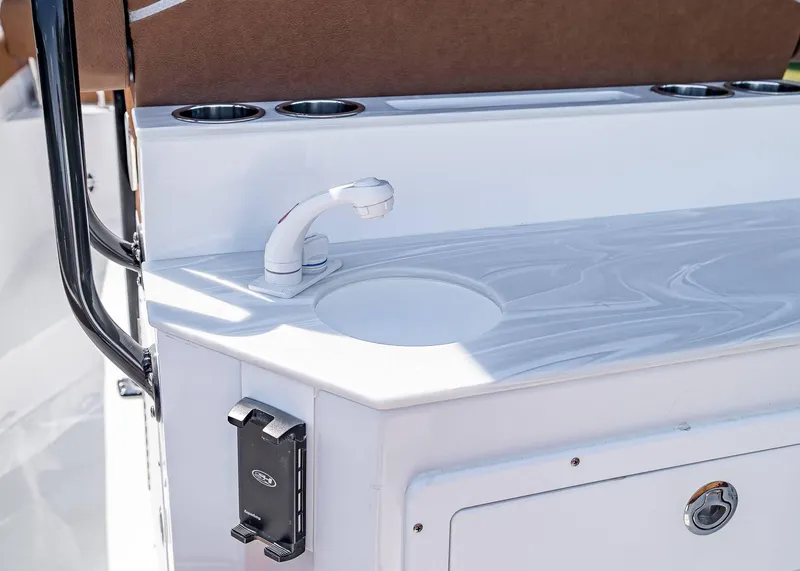 Slide: The Image of 2025 Sea Hunt Ultra 245 SE boat sink and countertop detail. - 17