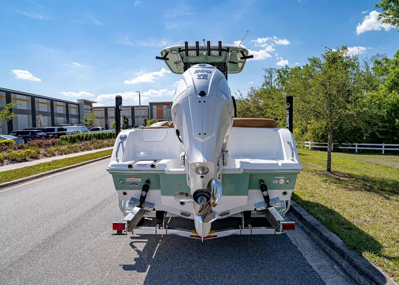 Slide: The Image of 2025 Sea Hunt Ultra 245 SE boat on trailer, rear view, sunny day. - 5
